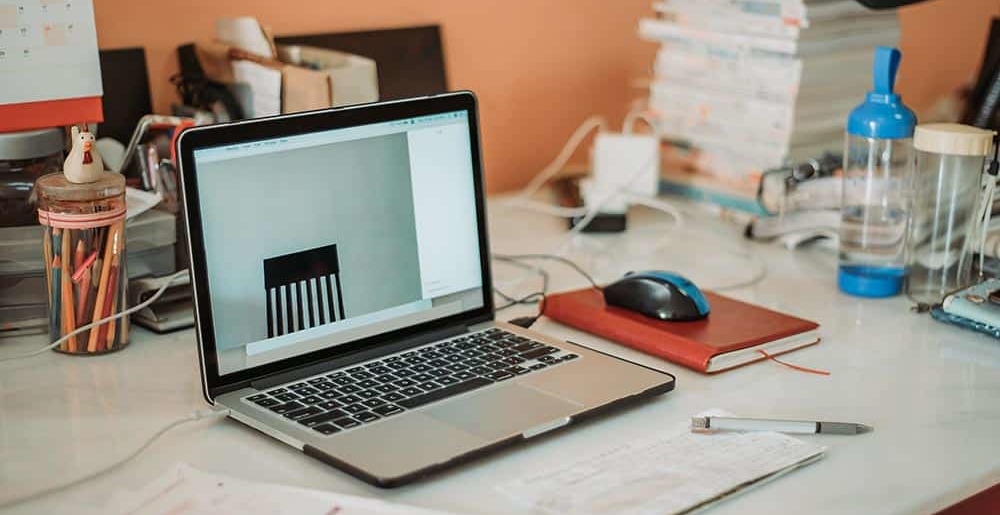 An image of a laptop on a desk, symbolizing the evolving employment landscape discussed in the blog on 'Changes in Employment – What This Means for the Reentrant in 2021.