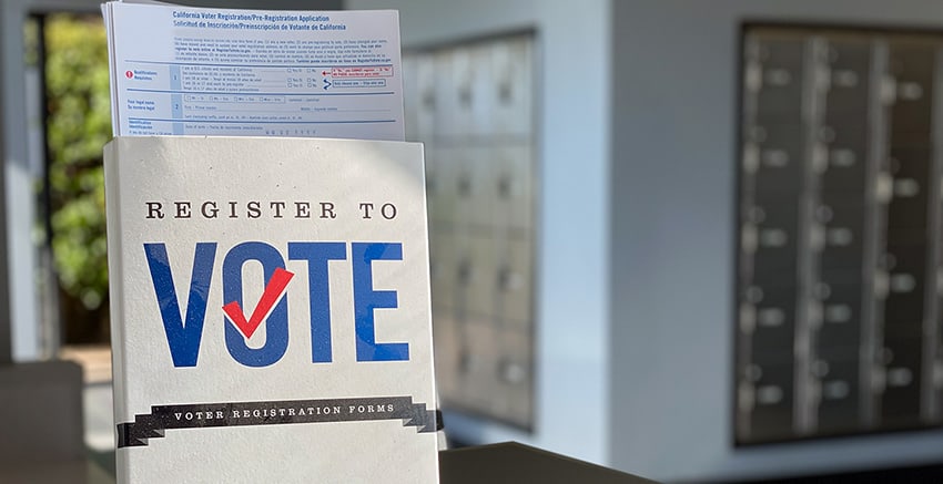 An image of a 'Register to Vote' folder with a ballot inside, signaling the theme of the blog on changed voting laws and eligibility, urging individuals to stay informed and exercise their right to vote.