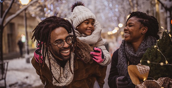 A family savoring the outdoors in winter, capturing the essence of overcoming winter blues by finding joy and connection in the seasonal beauty.