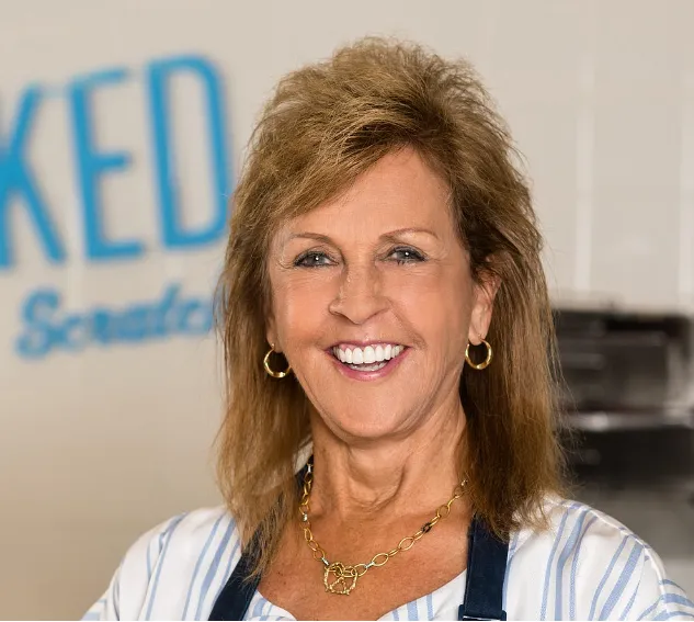 Headshot of Anne Beiler, founder of successful pretzel business despite education challenges. 