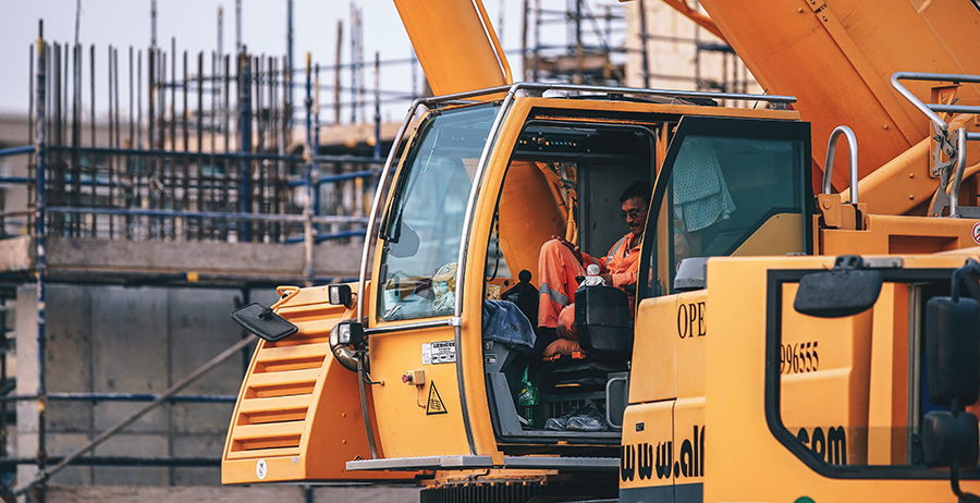 Student in a forklift training program learns to lift, handle, and place a heavy load.