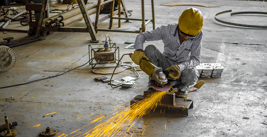 Student in welding apprenticeship program practices his skills.