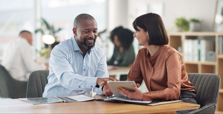 Man opening a bank account, taking steps to rebuild his financial life after prison.